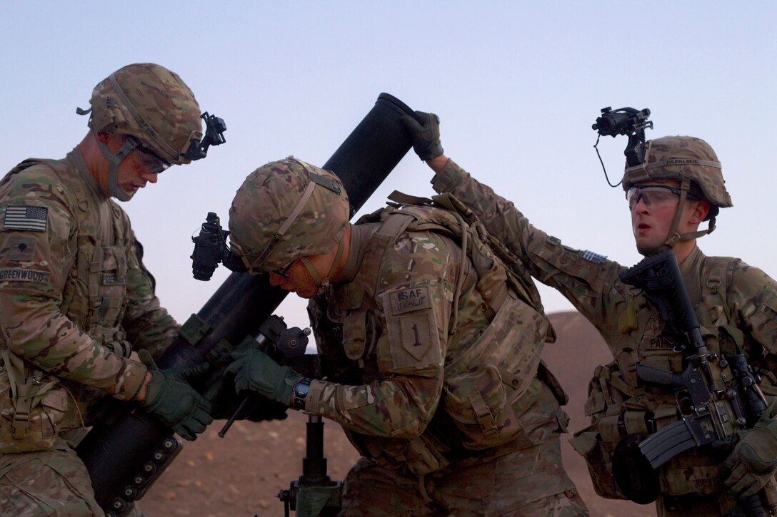 U.S. Army Spc. Aaron Greenwood, left, U.S. Army Pfc. Amadeus Schroeder, center, and U.S. Army Pfc. Peter Papalexis, right, establish their observation post as the sun begins to rise over the mountains near Combat Outpost Khilaguy, Afghanistan, Nov. 9, 2013. Greenwood, Schroeder and Papalexis are mortarmen assigned to the 1st Infantry Division's 6th Squadron, 4th Cavalry Regiment, 3rd Brigade Combat Team.