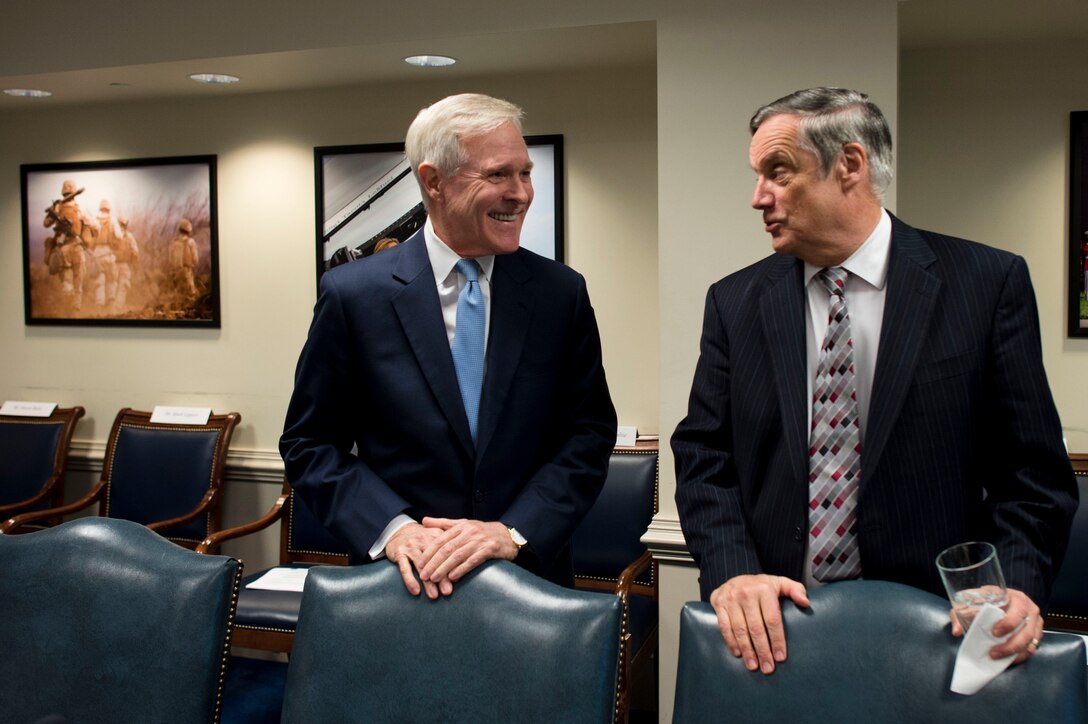 Navy Secretary Ray Mabus speaks with Robert F. Hale, the Pentagon's comptroller, before a meeting with Defense Secretary Chuck Hagel and his Senior Leadership Council at the Pentagon, Nov. 12, 2013.

