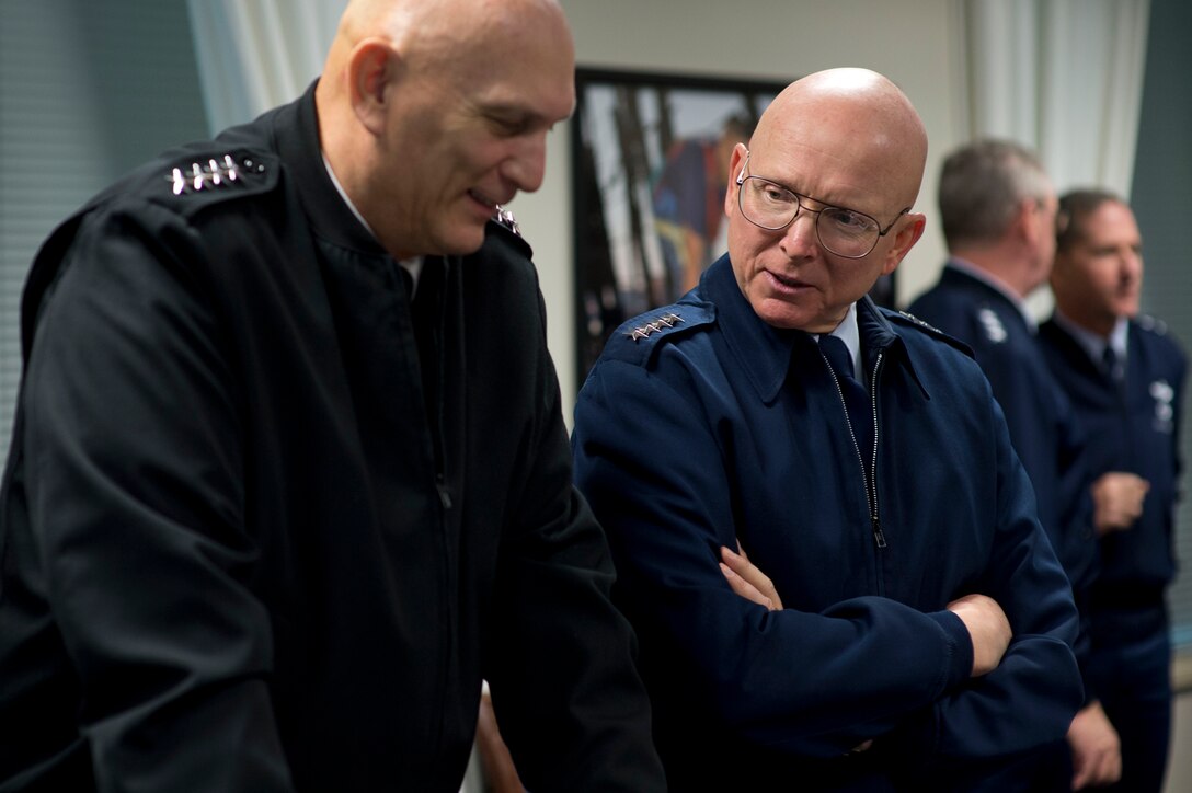 Coast Guard Commandant Adm. Robert J. Papp Jr., right, speaks with Army Chief of Staff Gen. Ray Odierno before a meeting with Defense Secretary Chuck Hagel and his Senior Leadership Council at the Pentagon, Nov. 12, 2013. 
