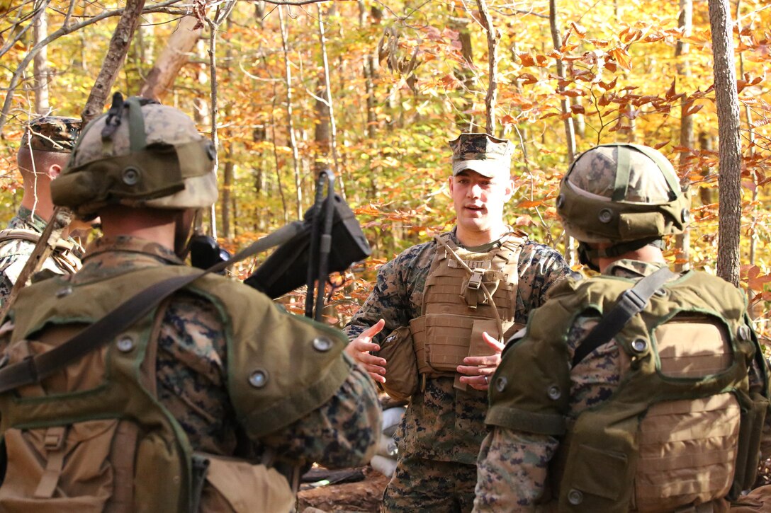 Sgt. Brian Willett, 2nd Platoon advisor, talks to students during a field exercise with The Basic School aboard Marine Corps Base Quantico on Nov. 6, 2013. The company of 248 Marines participated in the final field exercise before graduation. 