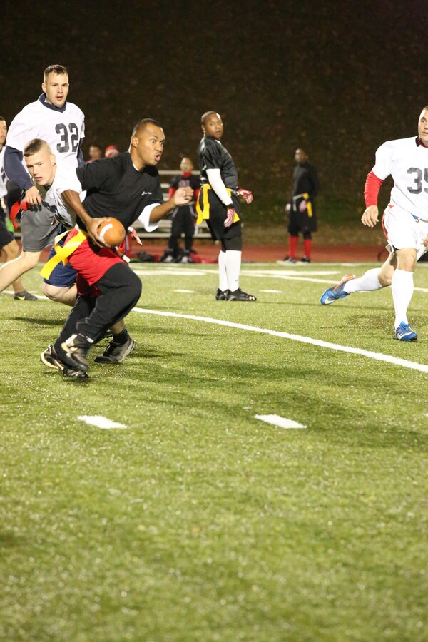 An M&RA Black Ops player runs the ball during a game against the H&S Finance team at Butler Stadium on Nov. 5, 2013. The Black Ops beat the Finance team 50-0.