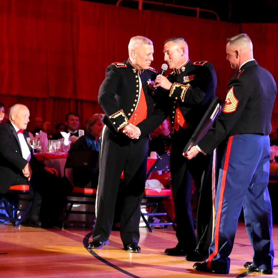 MARINE CORPS BASE CAMP LEJEUNE, N.C. – General John M. Paxton, The Assistant Commandant of the Marine Corps (left), is presented gifts from Brig Gen. James W. Lukeman, the 2nd Marine Division Commanding General and Sgt. Maj. Bryan Zickfoose, the 2nd Marine Division sergeant major, on behalf of the officers and staff noncommissioned officers of the 2nd Marine Division during the Division’s celebration of the 238th birthday of the Marine Corps, aboard Camp Lejeune, N.C., Nov. 7, 2013.