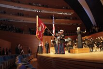 Marines with 9th Marine Corps District present the colors at the Kauffman center during the playing of the National Anthem played by the Kansas University Wind Ensemble Nov. 10, 2013. 