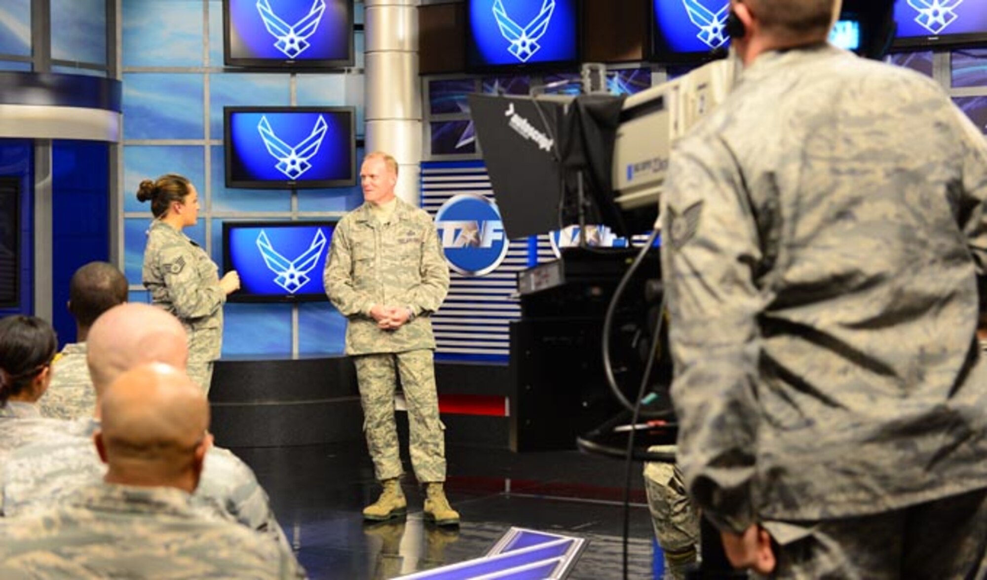 Chief Master Sgt. of the Air Force James Cody (center) is interviewed by Staff. Sgt. Shaun Hostutler (left) during a taping of "CHIEFChat" Nov. 12, 2013, at the Defense Media Activity at Fort George G. Meade, Md. Cody answered questions from live audience members as well as from Air Force social media channels and prerecorded video questions from Airmen. Cody discussed issues ranging from promotion testing to sexual assault prevention.