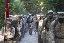 Virginia Beach, Va (Sept. 27, 2013) - Col. Paul Ryan, commanding officer, Headquarters and Service Battalion, U.S. Marine Corps Forces Commnad, carries an M240G medium machine gun up the tactical column during a six-mile conditioning hike aboard Joint Expeditionary Base Little Creek, Fort Story Sept. 27. The hike was designed to test the unit's combat readiness and build unit cohesiveness and morale.