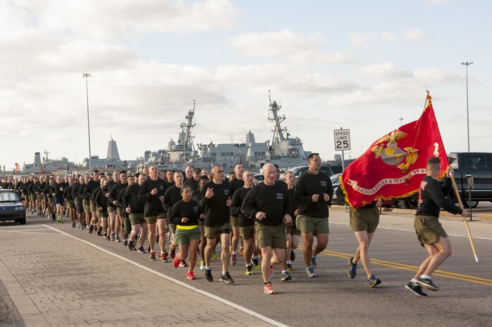 NORFOLK, Va. (Nov. 4, 2013) - The commanding officer of Headquarters and Service Battalion, U.S. Marine Corps Forces Command, Col. Paul Ryan, leads his Marines and Sailors on a run along the pier at Naval Station Norfolk Nov. 4. The run was scheduled commemorated the 238th Marine Corps Birthday. Marine Corps Community Service provided commemorative shirts before the run and snacks and drinks afterward.