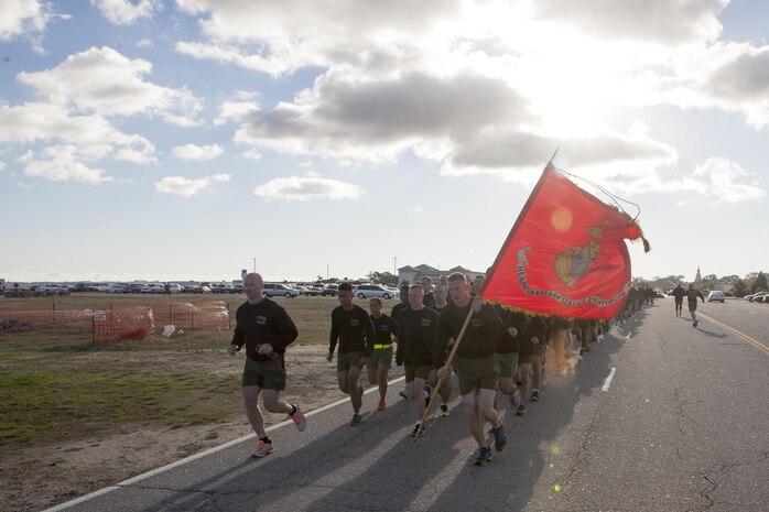 NORFOLK, Va. (Nov. 4, 2013) - The commanding officer of Headquarters and Service Battalion, U.S. Marine Corps Forces Command, Col. Paul Ryan, leads his Marines and Sailors on a run along the pier at Naval Station Norfolk Nov. 4. The run was scheduled commemorated the 238th Marine Corps Birthday. Marine Corps Community Service provided commemorative shirts before the run and snacks and drinks afterward.