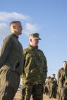 NORFOLK, Va. (Nov. 4, 2013) - Lt. Gen. Richard T. Tryon, Commander, U.S. Marine Corps Forces Command, speaks with Sgt. Matthew Sweigert, training noncomissioned officer, Headquarters and Service Battalion, MARFORCOM before a formation run commemorating the 238th Marine Corps Birthday. The Marines ran along the pier at Naval Station Norfolk, after which, Marine Corps Community Service provided snacks and drinks.