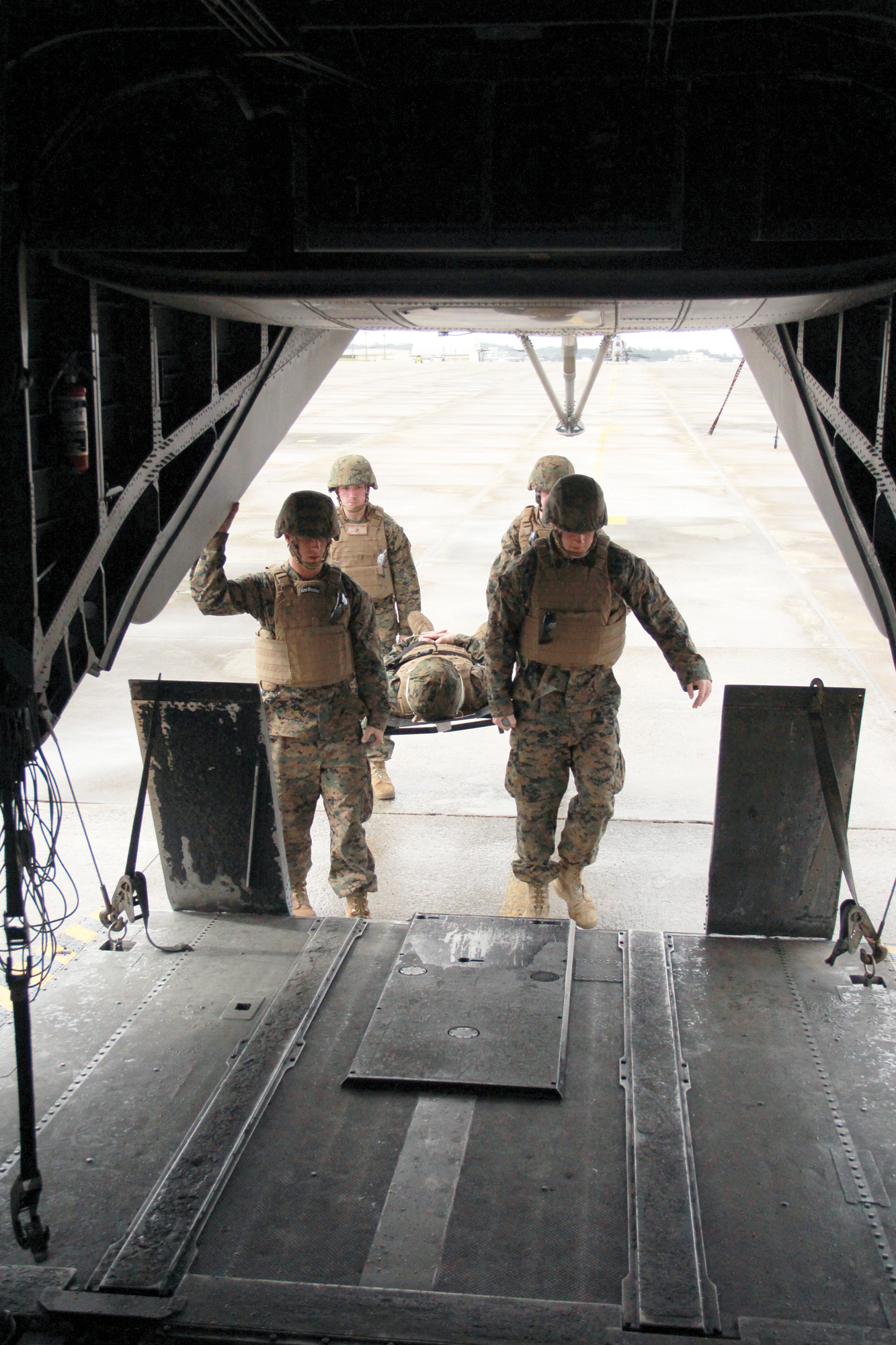 Marines and sailors embark a CH-53E Super Stallion helicopter Nov. 7 at Marine Corps Air Station Futenma during a casualty evacuation drill. The Marines and sailors are with 3rd Medical Battalion, 3rd Marine Logistics Group, III Marine Expeditionary Force. The CH-53E and crew are with Marine
Heavy Helicopter Squadron 772, currently assigned to Marine Aircraft Group 36, 1st Marine Aircraft Wing, III MEF, under the unit deployment program. (U.S. Marine Corps photo by Lance Cpl. Donald T. Peterson/Released)