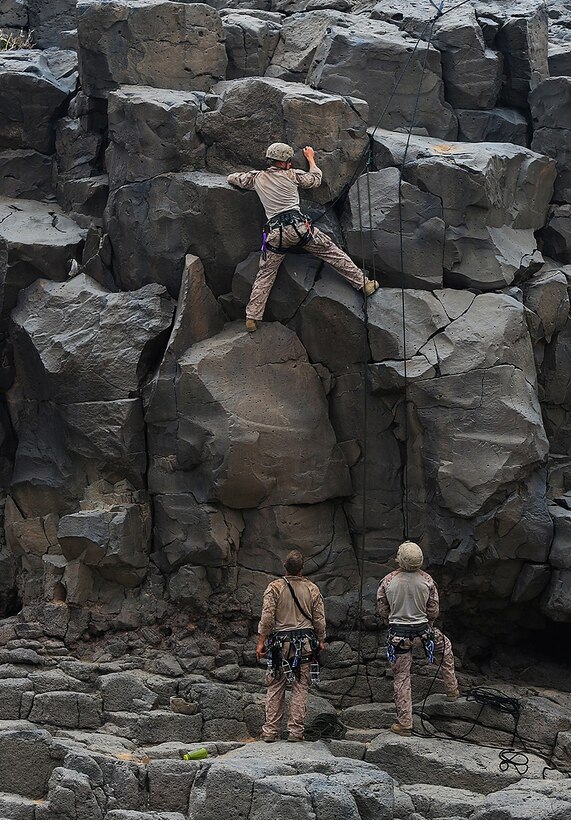 DJIBOUTI, AFRICA (Nov. 2, 2013) – A Marine from 1st Battalion, 4th Marines, 13th Marine Expeditionary Unit climbs up a natural rock gorge during a day of sustainment training in assault climbing Nov. 2, 2013.  The 13th MEU is deployed with the Boxer Amphibious Ready Group as a theater reserve and crisis response force throughout the U.S. 5th Fleet area of responsibility. (USMC photo by SSgt. Matt. Orr/Released)