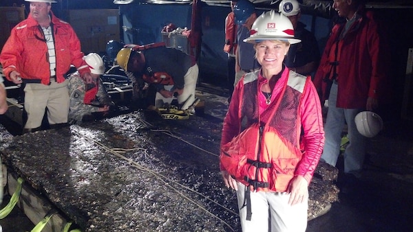 Julie Morgan, a staff archeologist with the U.S. Army Corps of Engineers Savannah District, stands next to a 5,000-pound piece of the CSS Georgia, a Civil War ironclad scuttled in the Savannah River in 1864. Removing the remains of the CSS Georgia is an environmental mitigation feature as part of the Savannah Harbor Expansion Project, a plan to deepen the Savannah shipping channel from 42 feet to 47 feet.USACE photo by Jason Okane.