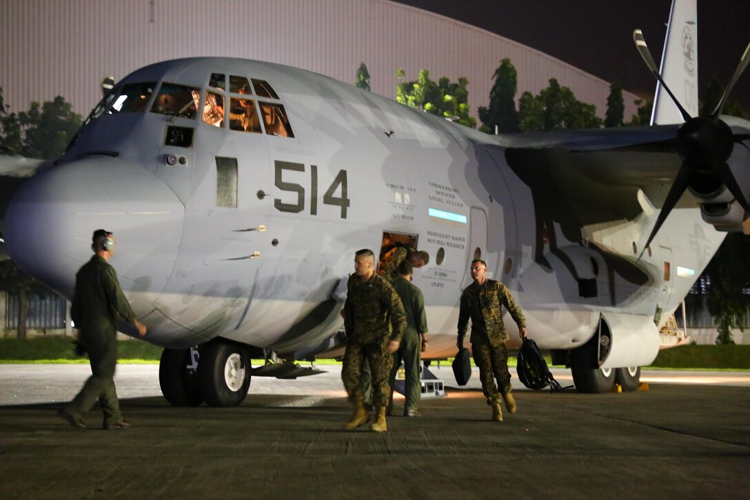 Approximately 80 U.S. Marines from the 3rd Marine Expeditionary Brigade arrive at Villamor Air Base, on two KC-130J Super Hercules aircraft Nov. 10. Marine Corps Forces, Pacific is working with the Philippine government to rapidly deliver humanitarian assistance and disaster relief. The KC-130J aircraft are with Marine Aerial Refueler Transport Squadron 152, Marine Aircraft Group 36, 1st Marine Aircraft Wing, III Marine Expeditionary Force. (U.S. Marine Corps photo by Capt. Joshua Diddams/Released)


