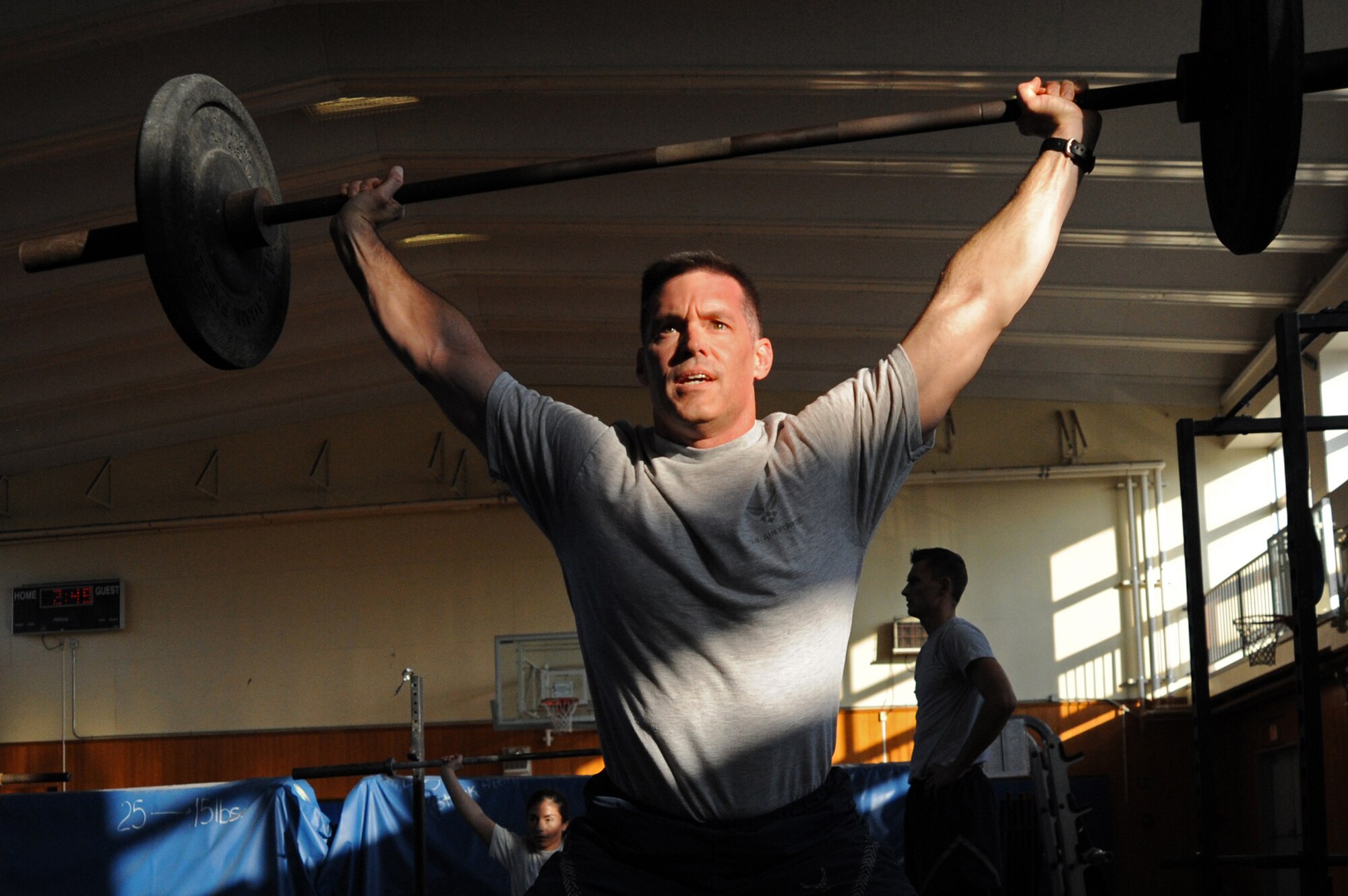 Lt. Col. Hall Sebren, 35th Maintenance Group deputy commander, works out at the fitness center at Misawa Air Base, Japan, Nov. 5, 2013. Sebren leads a daily early morning workout for Misawa Airmen and dependents. (U.S. Air Force photo by Senior Airman Derek VanHorn)