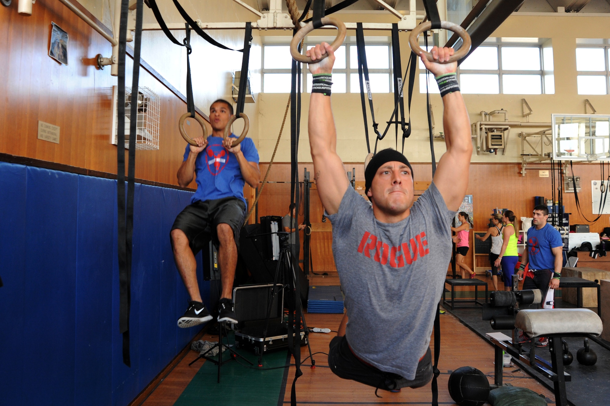 Staff Sgt. Charlie Orantes, right, 35th Security Forces Squadron military working dog handler, works out alongside Senior Airman Marc Bates, 35th Communications Squadron postal clerk, at Misawa Air Base, Japan, Nov. 5, 2013. Orantes deployed to Afghanistan and Iraq and credited the success of his efforts there to a commitment to fitness. (U.S. Air Force photo by Senior Airman Derek VanHorn)
