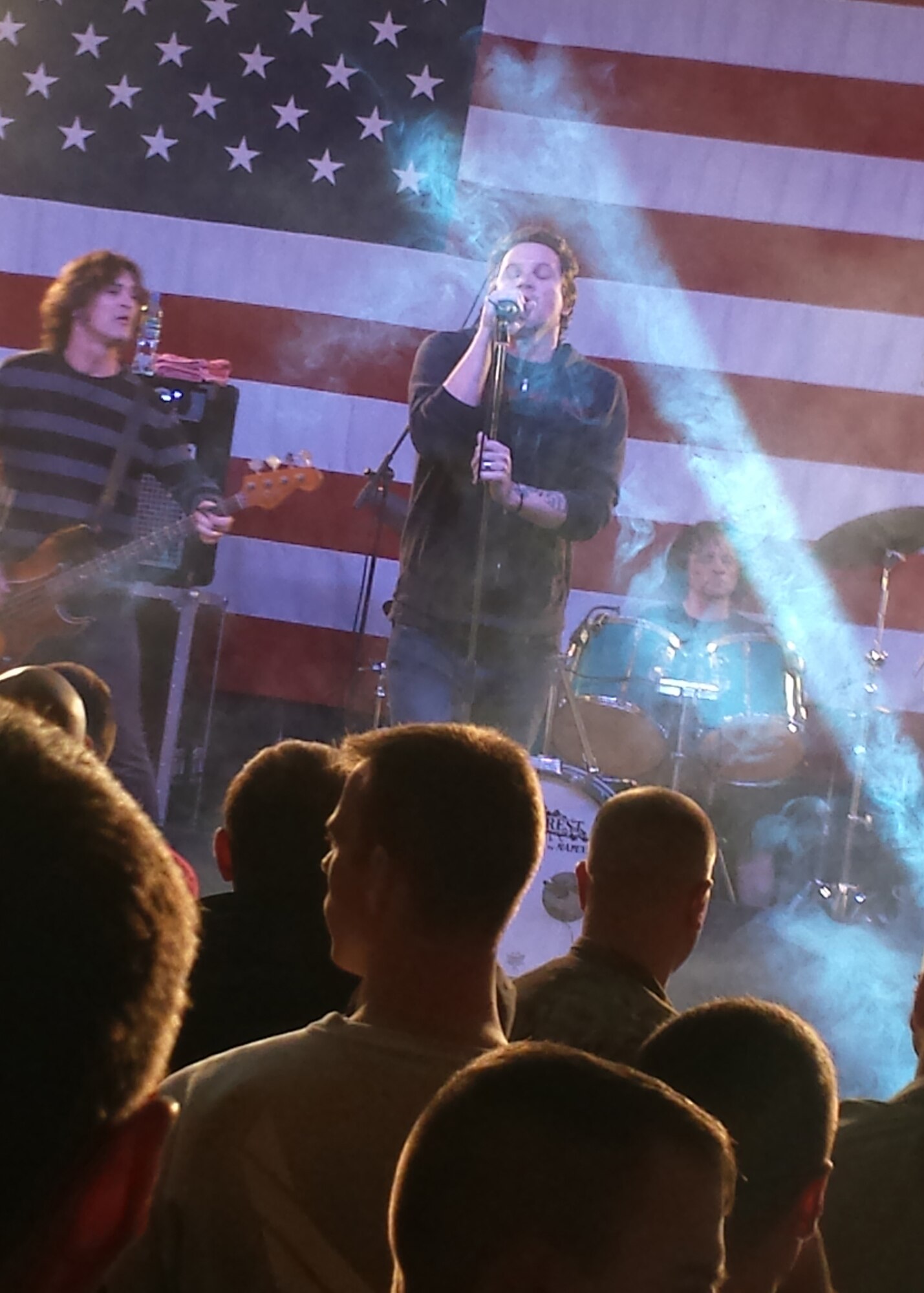 Kevin Martin heads a Candlebox performance on Veteran?s Day at Transit Center at Manas, Kyrgyzstan, Nov. 11, 2013. Martin, lead vocalist, Peter Klett, lead guitarist, and Scott Mercado, drums, make up the core members of the band. (U.S. Air Force photo/Staff Sgt. Rebecca Higgins)