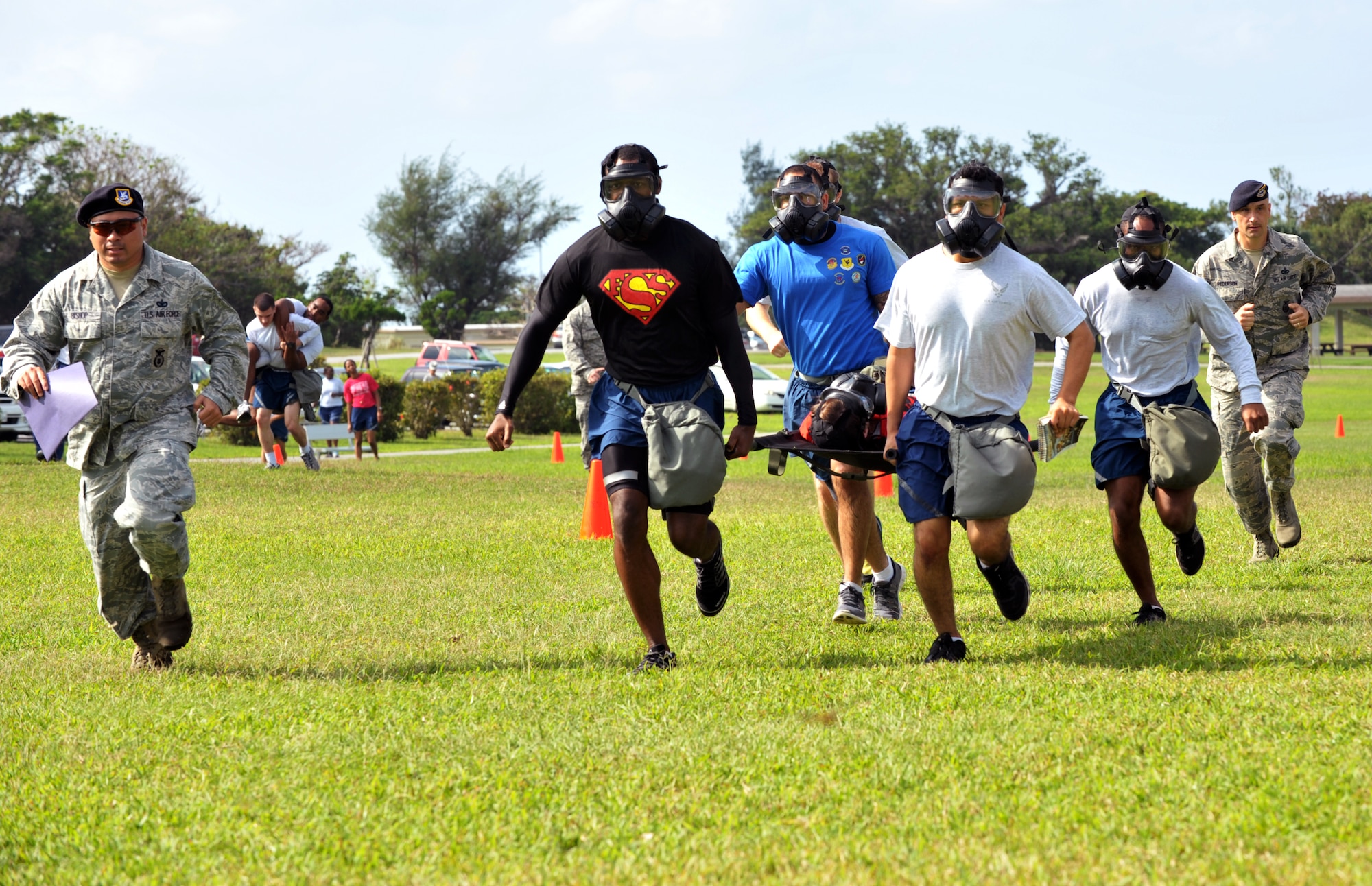 U.S. Air Force Airmen from the 18th Mission Support Group race during the 18th MSG Sports Day at Marek Park on Kadena Air Base, Japan, Nov. 8, 2013. During the event, five different squadrons competed in softball, dodge ball, basketball, football, a defenders challenge and tug-of war. (U.S. Air Force photo by Naoto Anazawa)