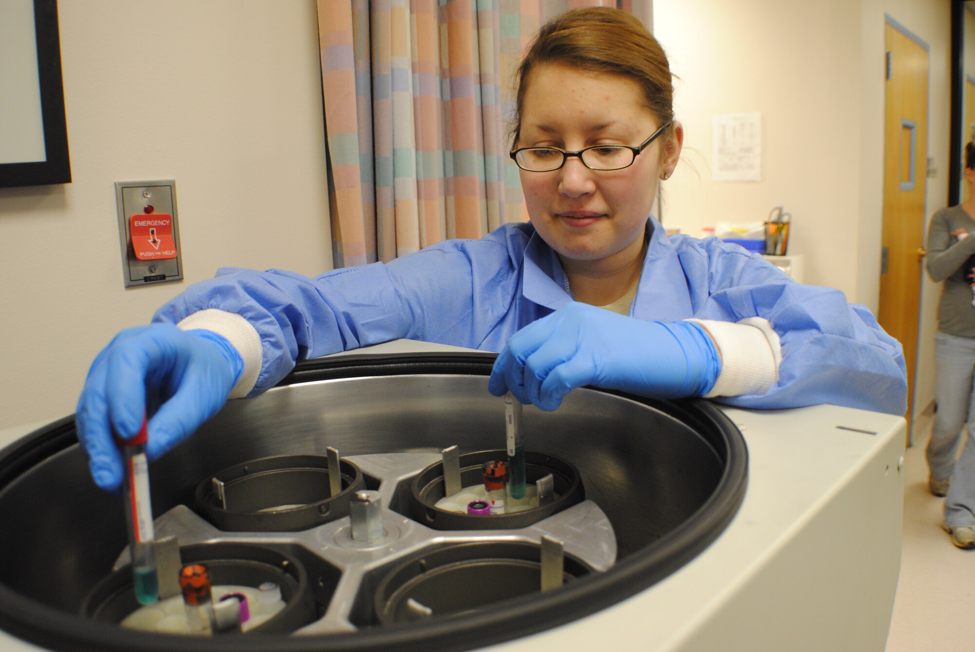 Senior Airman Katherine Herzer, 319th Medical Support Squadron laboratory technician, places liquid samples in a centrifuge, Nov. 8, 2013, at the medical laboratory on Grand Forks Air Force Base, N.D. A centrifuge is a piece of laboratory equipment, driven by a motor, which spins liquid samples at high speed to separate substances of greater and lesser density. (U.S. Air Force photo/Staff Sgt. Luis Loza Gutierrez)