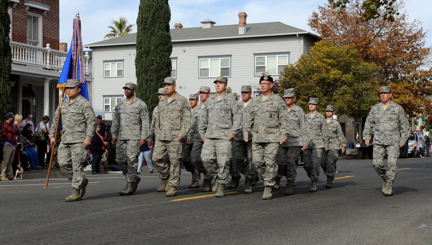 Members of the 940th Reserve Wing march during the Yuba/Sutter Veterans Day Parade in Marysville, Calif., Nov. 11, 2013. Col. Phil Stewart, 9th Reconnaissance Wing commander, served as the grand marshal of the event. (U.S. Air Force photo by Staff Sgt. Robert M. Trujillo/Released)