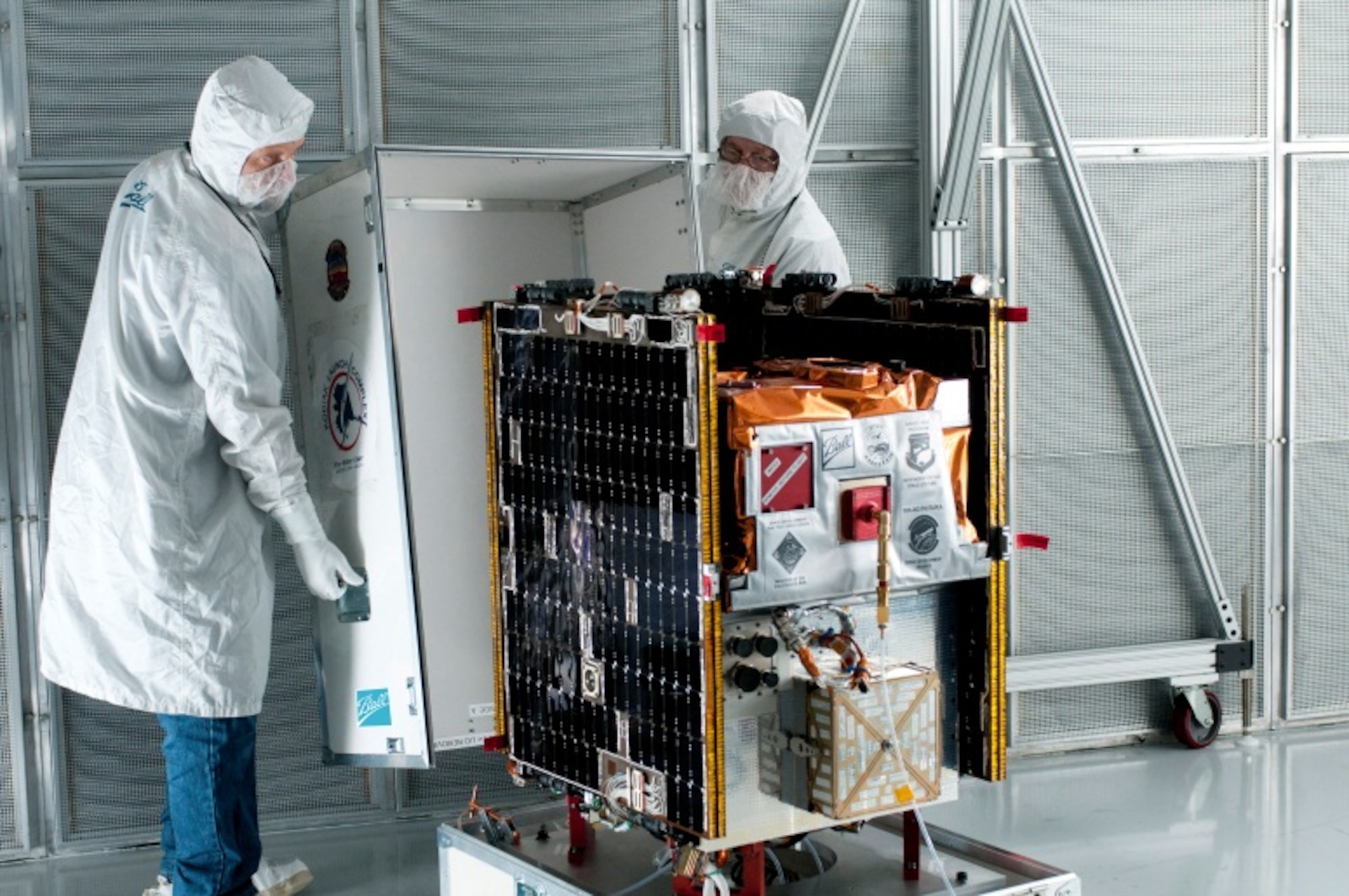 The Kirtland-managed Space Test Program Satellite-3 is being loaded into
its storage crate on its way to NASA's Wallops Flight Facility, Va. from its Ball
Aerospace factory in Boulder, Colo. The satellite is scheduled to launch Nov. 19 aboard a Minotaur I rocket.