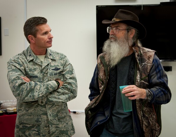 Col. Barry Cornish, 99th Air Base Wing commander, talks with Duck Dynasty star, Si Robertson, prior to his book signing appearance at the Base Exchange Nov. 12, 2013, at Nellis Air Force Base, Nev.  Uncle Si, as he is commonly known, met with fans and autographed copies of his book, “Si-cology 1: Tales and Wisdom from Duck Dynasty’s Favorite Uncle” at the Exchange. (U.S. Air Force photo by Master Sgt. Jason W. Edwards)