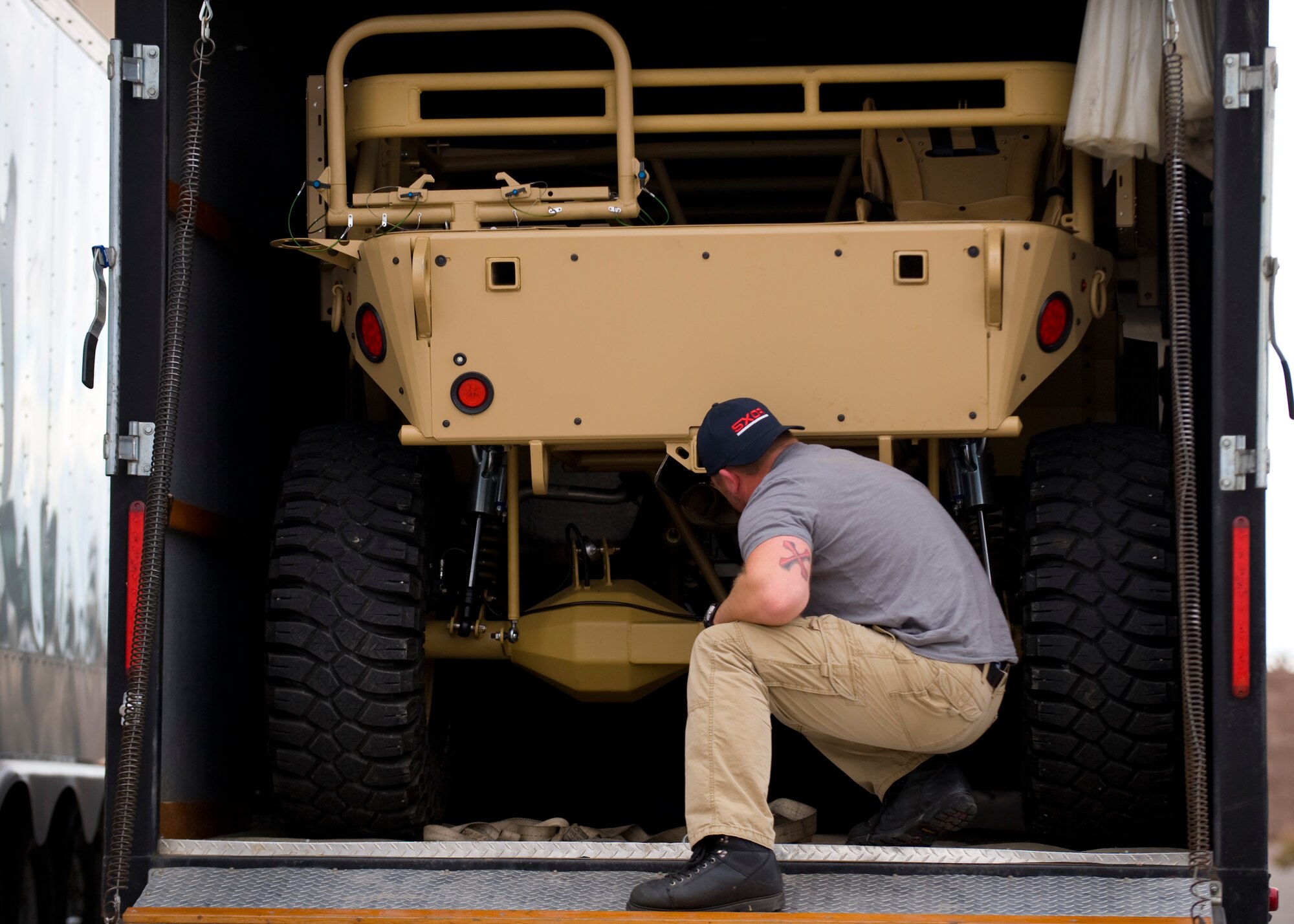 Brandon Johnson, BC Customs designer, unloads a Guardian Angel Air Deployable Vehicle Nov. 12, 2013, at Nellis Air Force Base, Nev. The GAARV is a multi-purpose utility vehicle intended to expand combat search and rescue capabilities while shortening response time. (U.S. Air Force photo by Airman 1st Class Jason Couillard)