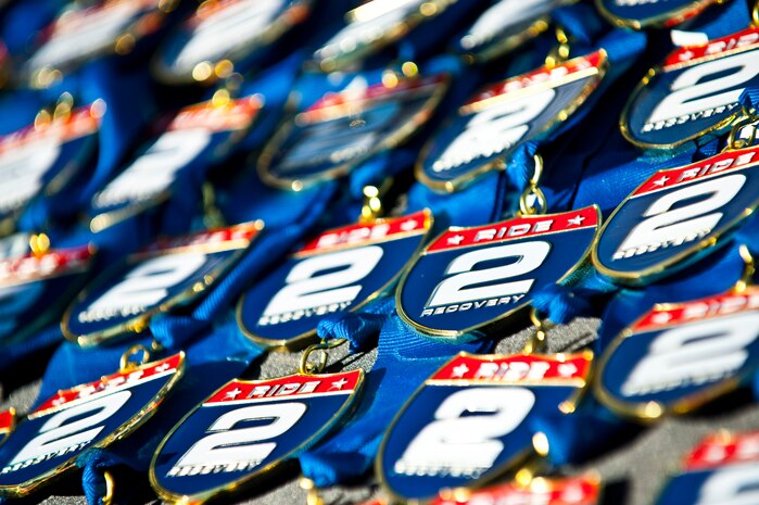 Ride 2 Recovery medals lay on a table at the R2R Honor Ride Nov. 9, 2013, on the Las Vegas strip. The R2R Honor Ride’s mission is to improve the health and wellness for wounded, injured or ill servicemen and women with cycling as the core activity. (U.S. Air Force photo by Senior Airman Brett Clashman)