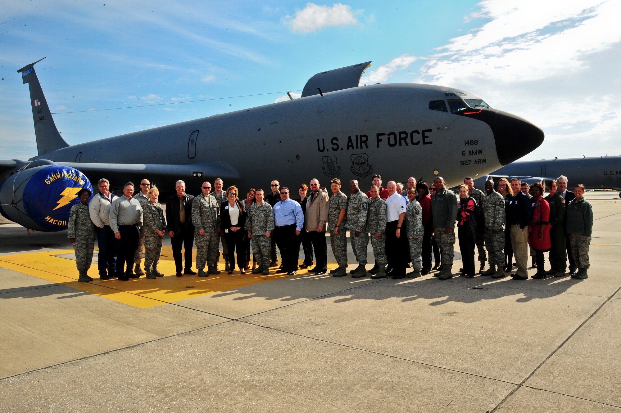 Local civic leaders pose with military members in front of a KC-135 Stratotanker at MacDill Air Force Base, Fla., Nov. 13, 2013. Twenty-five local civic leaders were invited to pair with 25 base members for a day-long base tour and on-the-job experience. (U.S. Air Force photo by Airman 1st Class Ned T. Johnston/Released)