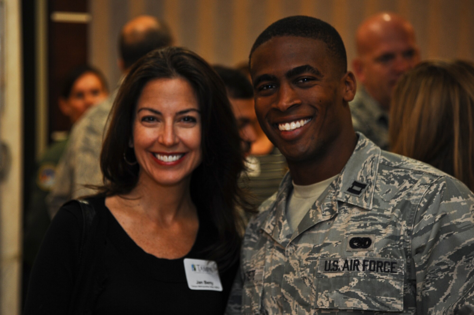 Capt. Allen Batiste, 6th Logistics Readiness Squadron material management flight commander, poses for a photo with Jan Berry, Tampa Metropolitan Area YMCA chief development officer, at Operation Partnership’s breakfast meet and greet at MacDill Air Force Base, Fla., Nov. 13, 2013. Twenty-five local civic leaders were invited to pair with 25 base members for a day-long base tour and on-the-job experience. (U.S. Air Force photo by Airman 1st Class Ned T. Johnston/Released)