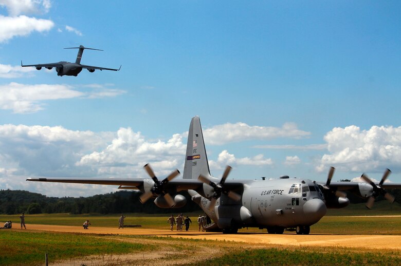 Mobility aircraft load up and take off at the 2013 Warrior Exercise in late July.  Approximately 14 919th Special Operations Wing firefighters supported the exercise and received their annual fire training while there.  (Courtesy photo)