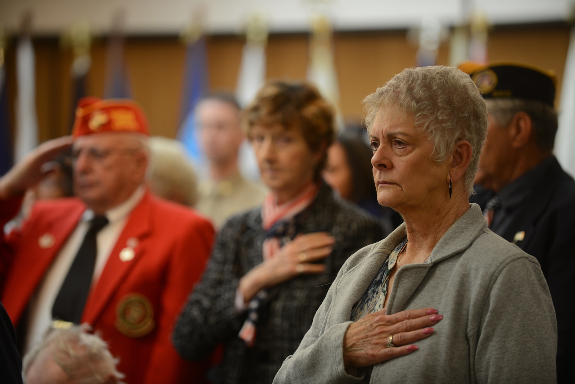 A women holds her hand over her heart during the playing of the Taps Nov.
11, 2013, in Boise, Idaho. Many veterans gathered at the Idaho State Veterans home to show respect for fallen comrades.(U.S. Air Force photo by Airman 1st Class Brittany A. Chase/Released)
