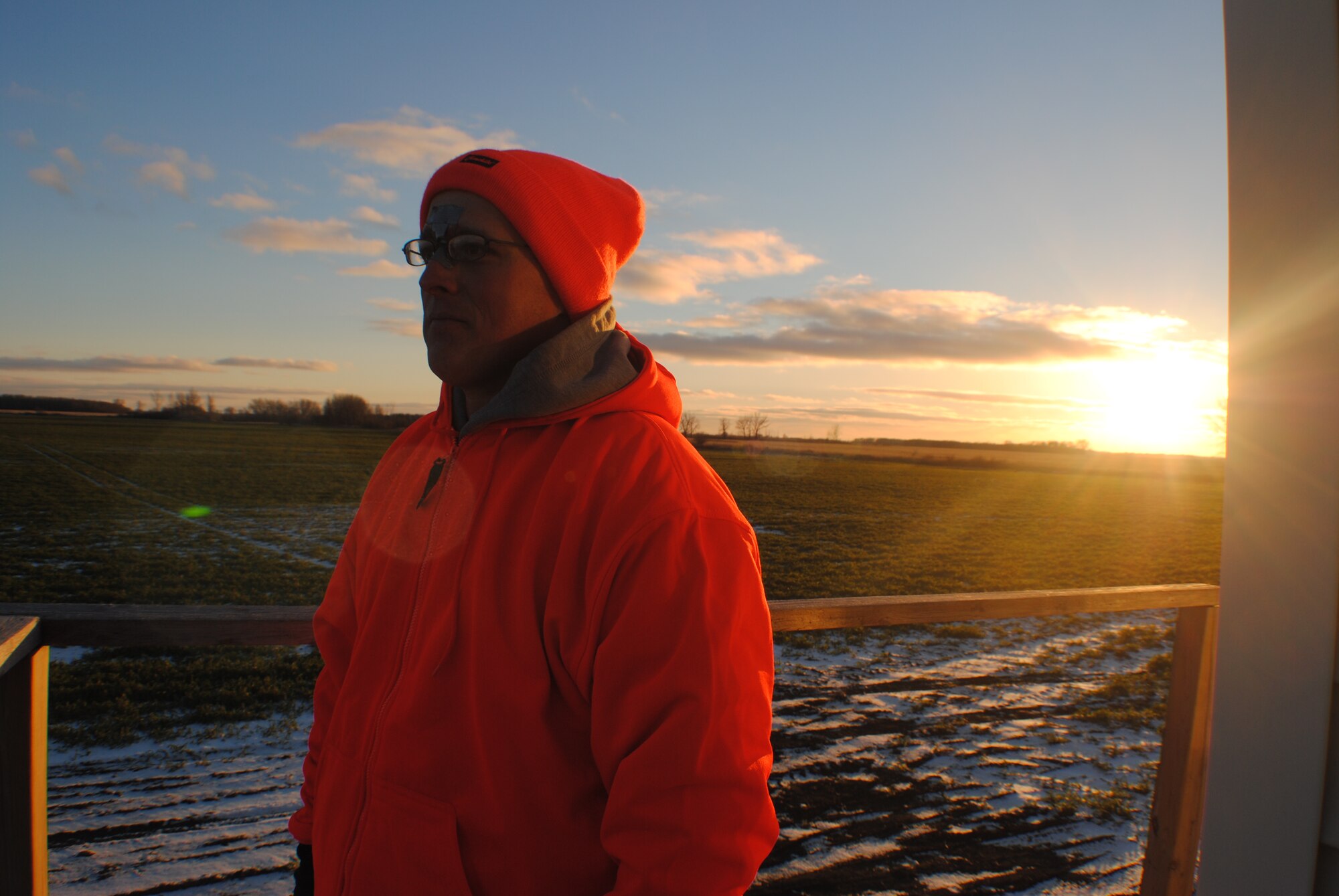 Tech. Sgt. Joshua Robistow, a Wounded Warrior and active-duty member with the 319th Civil Engineer Squadron, reflects on his first hunting experience, which took place on a farm just a few miles from the town of Warren, Minn. The deer hunt was sponsored by professional military organizations from Grand Forks Air Force Base, N.D., and the Oberg Land Company. Robistow described the outing as an awesome and unforgettable experience, which made him feel like his old self before his war wounds. (U.S. Air Force photo/Staff Sgt. Luis Loza Gutierrez) 