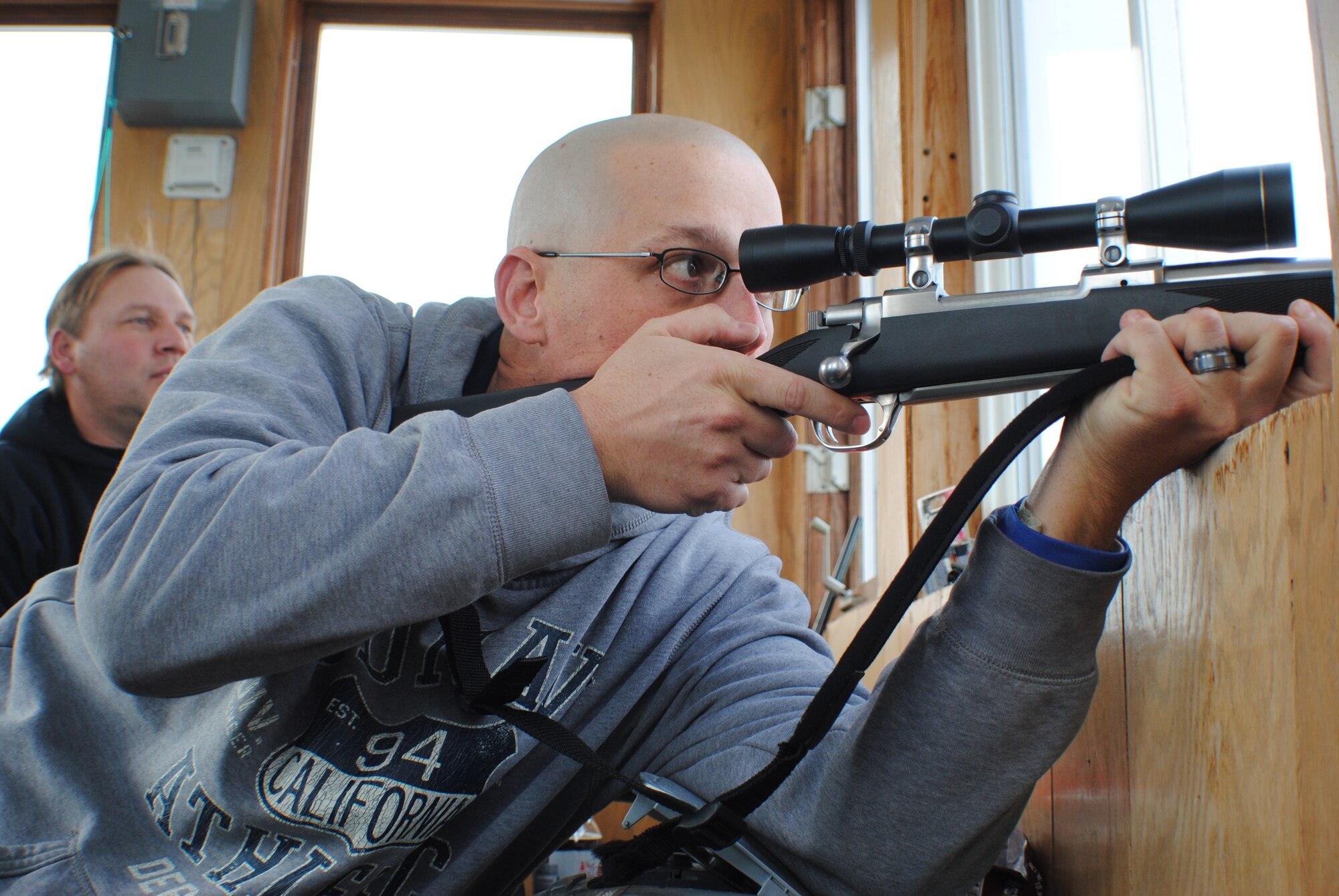 Tech. Sgt. Joshua Robistow, a Wounded Warrior and active-duty member with the 319th Civil Engineer Squadron, takes aim for his first shot at a buck during his first white tail deer hunt Nov. 11, 2013, on a farm just a few miles from the town of Warren, Minn. The outing was Robistow’s first hunting experience and was sponsored by professional military organizations from Grand Forks Air Force Base, N.D., and the Oberg Land Company. Robistow was wounded in November 2005 when an improvised explosive device struck his Humvee while deployed in support of Operation Iraqi Freedom. (U.S. Air Force photo/Staff Sgt. Luis Loza Gutierrez) 