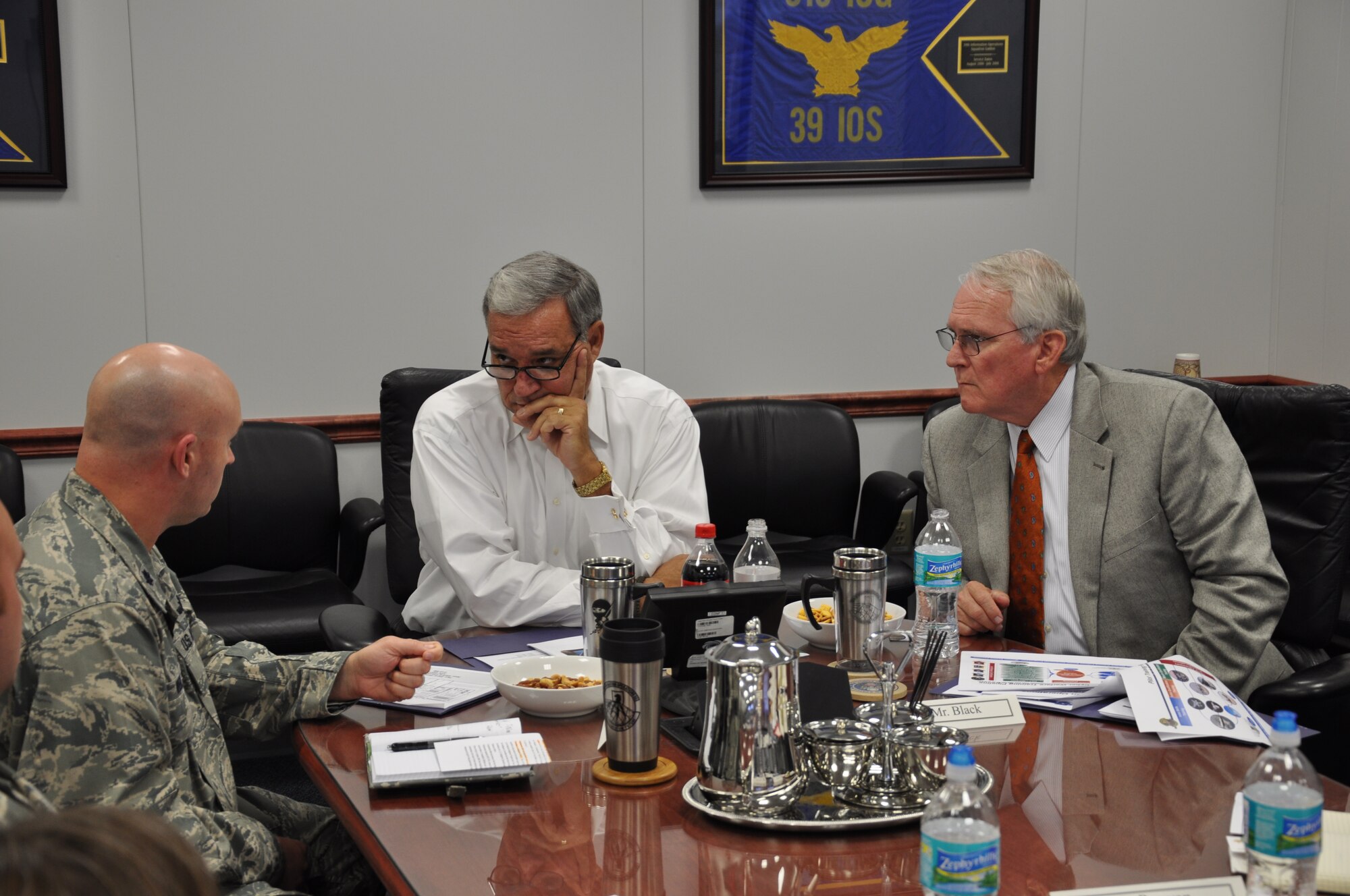 Lt. Col. Kiley Weigle, 39th Information Operations Squadron commander, left, briefs U.S. Rep. Jeff Miller, Florida’s First Congressional District, center, and Bob Black, Miller's aide, right, during a squadron site visit at Hurlburt Field, Fla., Nov. 6, 2013. The 39th IOS is the Air Force’s Formal Training Unit responsible for providing Information Operations and Cyber Operations training for the service. (U.S. Air Force photo/Capt. Casey Osborne)