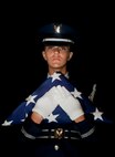 Senior Airman Kendra Koff, Minot Air Force Base Honor Guard member, poses for a studio portrait. The Minot AFB Honor Guard serves a distinct mission under unique conditions from performing military honors in North Dakota, to presenting colors on base. Members of the Base Honor Guard perform their ceremonial duties in addition to their primary Air Force specialty. The Minot AFB Honor Guard is comprised of Airmen, noncommissioned officers and officers from the 5th Bomb Wing and 91st Missile Wing. (U.S. Air Force photo/Senior Airman Brittany Y. Auld)