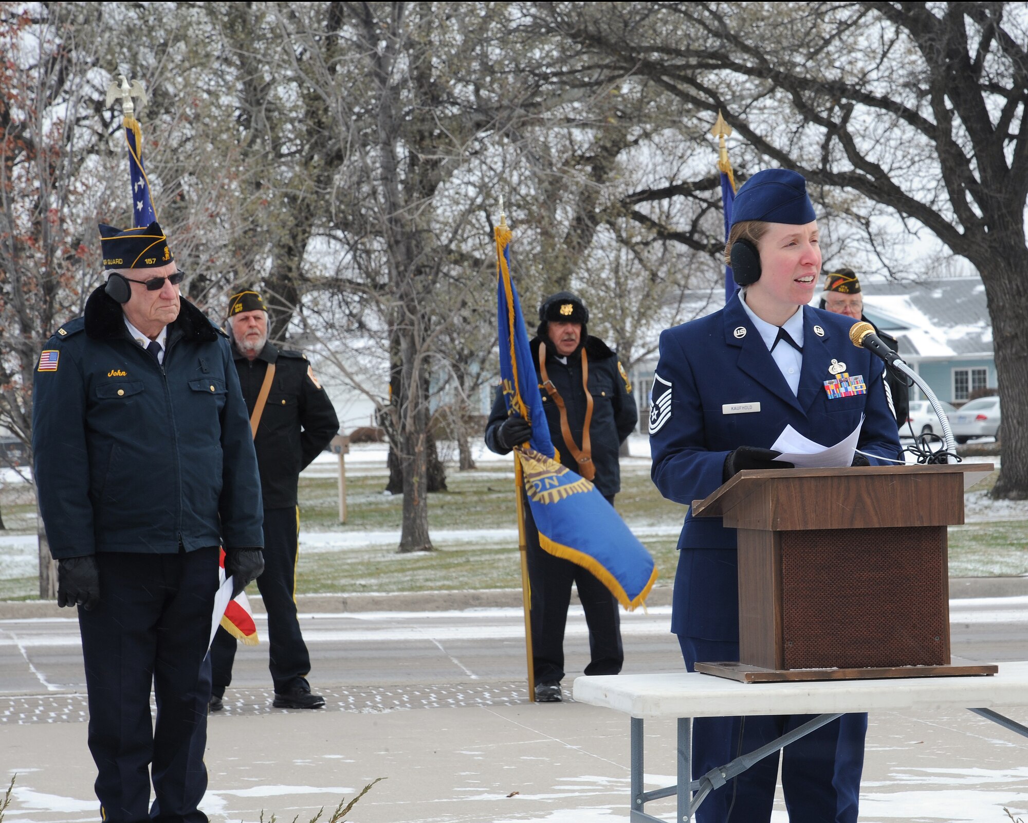Master Sgt. Robyn Kaufhold, 319th Communications Squadron communications security manager, gives a speech to Minnesota and North Dakota residents during a Veterans Day observance event in East Grand Forks, Minn., Nov. 11, 2013. Kaufhold spoke to approximately 60 attendees alongside members of American Legion Post 157. (U.S. Air Force photo by Airman 1st Class Zachiah Roberson)