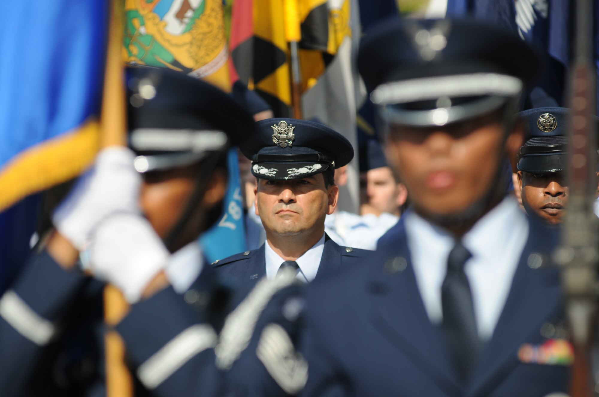 Col. René Romero, 81st Training Wing vice commander and Chief Master Sgt. Farrell Thomas, 81st TRW command chief, march in the 13th Annual Gulf Coast Veterans Day Parade along with the Keesler Honor Guard and Airmen who carried the 50 State Flags Nov. 9, 2013, Biloxi, Miss. Technical training squadron flights also participated in the event. (U.S. Air Force photo by Kemberly Groue)