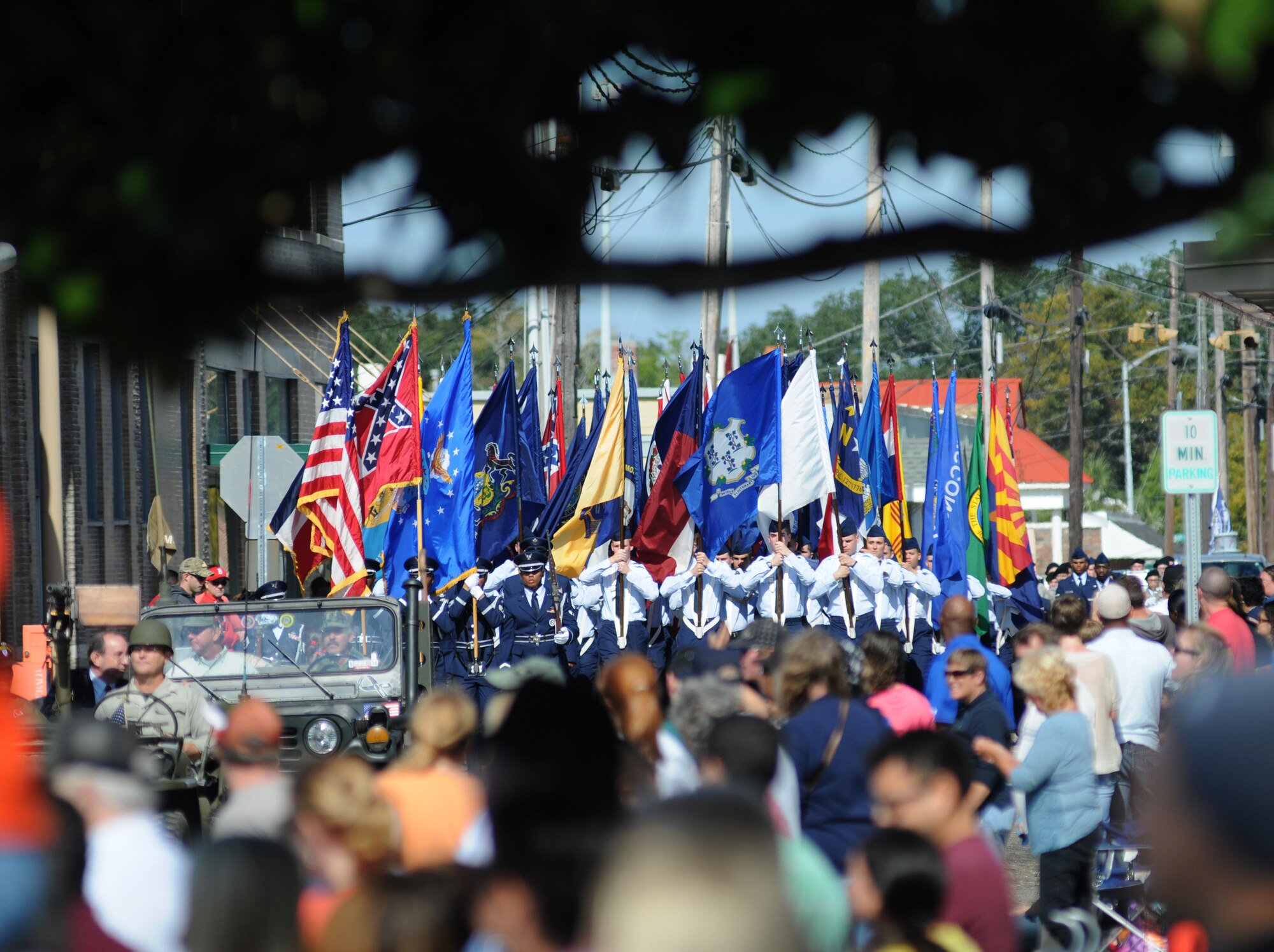 Airmen carrying the 50 State Flags participate in the 13th Annual Gulf Coast Veteran’s Day Parade Nov. 9, 2013, Biloxi, Miss. Keesler wing leadership and Honor Guard also participated in the event. (U.S. Air Force photo by Kemberly Groue)