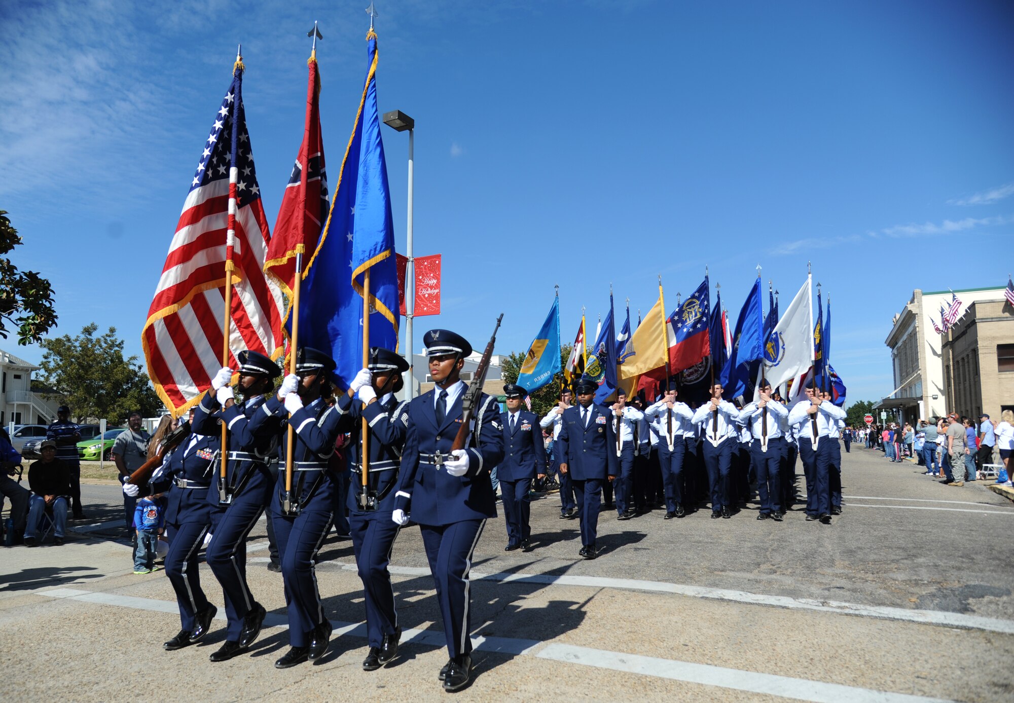 The Keesler Honor Guard, Wing leadership and Airmen march in the 13th Annual Gulf Coast Veterans Day Parade in front of City Hall Nov. 9, 2013, Biloxi, Miss.  Technical training squadron flights also participated in the event. (U.S. Air Force photo by Kemberly Groue)