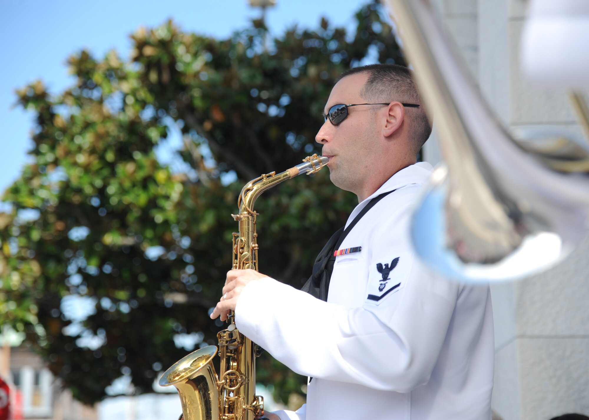 Musician 3rd Class Jason Jackson, New Orleans Navy Band, performs prior to the start of the 13th Annual Gulf Coast Veterans Day Parade in front of City Hall Nov. 9, 2013, Biloxi, Miss.  Keesler’s Wing leadership, Honor Guard, and Airmen, who carried the 50 State Flags, participated in the event.  (U.S. Air Force photo by Kemberly Groue)