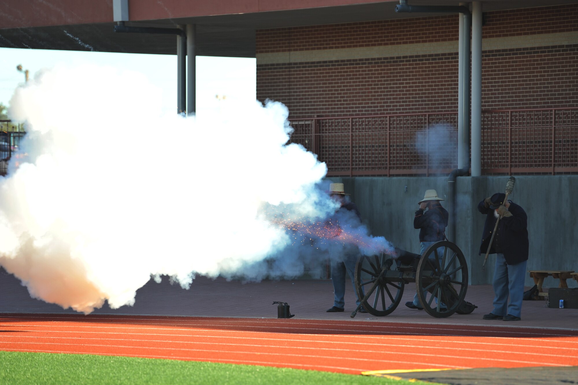 SAN ANGELO, Texas-- Re-enactors from Fort Concho, a historical Army fort dating before the Civil War, fire a cannon after Angelo State University scores a touchdown during Military Appreciation Day football game Nov. 9 at the LeGrand Stadium. All military personnel and family were invited by ASU to attend the Military Appreciation Day on ASU campus and at the football stadium. (U.S. Air Force photo/ Senior Airman Michael Smith)