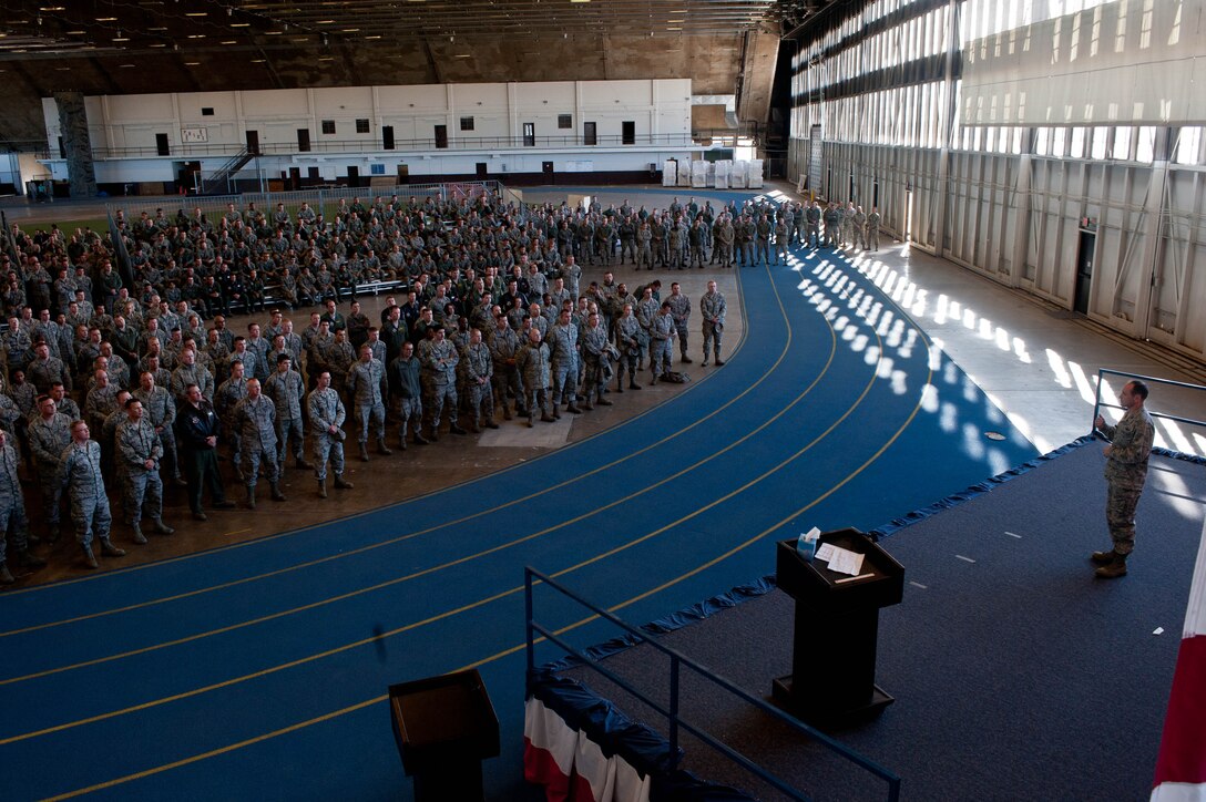Col. Kevin Kennedy, 28th Bomb Wing commander, speaks to Ellsworth Airmen during an event associated with Comprehensive Airman Fitness Day in the Pride Hangar at Ellsworth Air Force Base, S.D., Nov. 4, 2013. The base conducted a series of activities throughout the day, focusing on the mental pillar of the Comprehensive Airman Fitness concept. (U.S. Air Force photo by Senior Airman Zachary Hada/Released)