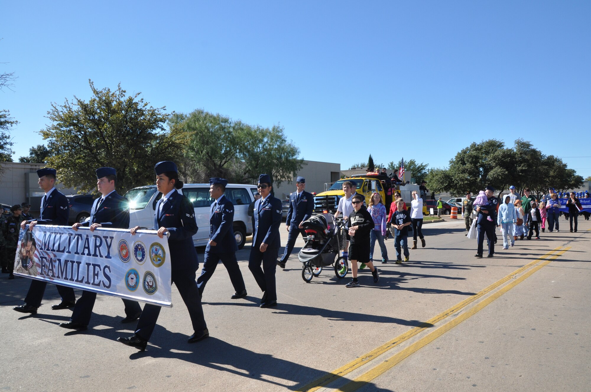 SAN ANGELO, Texas — Military members and their families march in a family flight during the Veteran’s Day Parade Nov. 9 in historic downtown San Angelo. The military family flight was an opportunity to recognize family members for their role in Team Goodfellow’s success. (U.S. Air Force photo/ Airman 1st Class Breonna Veal)