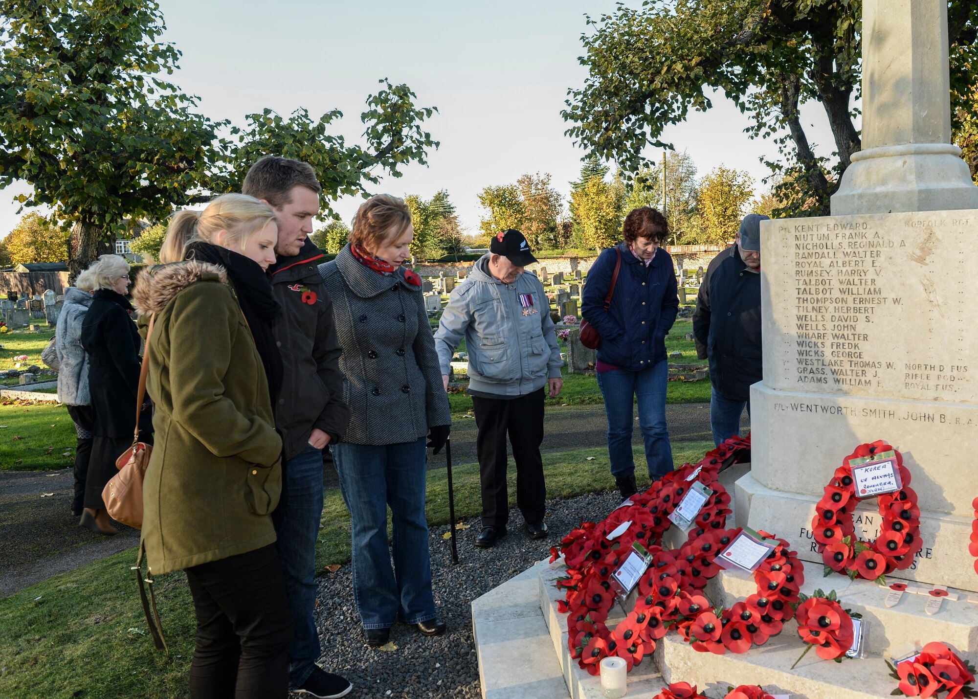 Community members pay their respects to fallen soldiers after the Remembrance Day ceremony at the Hillsboro Memorial Gardens in Brandon, England, Nov. 10, 2013. Remembrance Day, also known as Poppy Day, is observed in the commonwealth to honor members of the armed forces who died in the line of duty. (U.S. Air Force photo by Airman 1st Class Nigel Sandridge/Released)