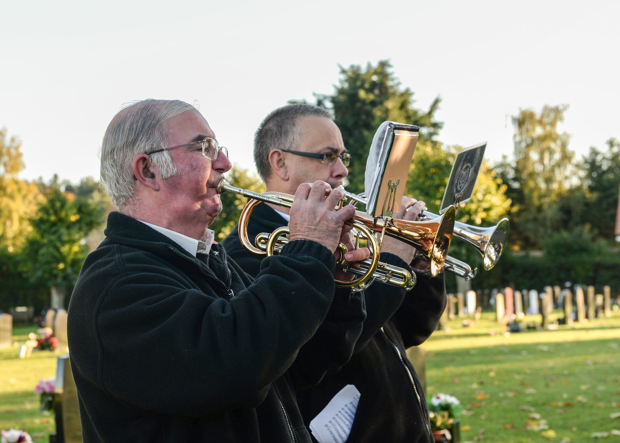 Ceremonial trumpeters play during the closing chapter of the Remembrance Day ceremony at the Hillsboro Memorial Gardens in Brandon, England, Nov. 10, 2013. Remembrance Day, also known as Poppy Day, is observed in the commonwealth to honor members of the armed forces who died in the line of duty. (U.S. Air Force photo by Airman 1st Class Nigel Sandridge/Released)