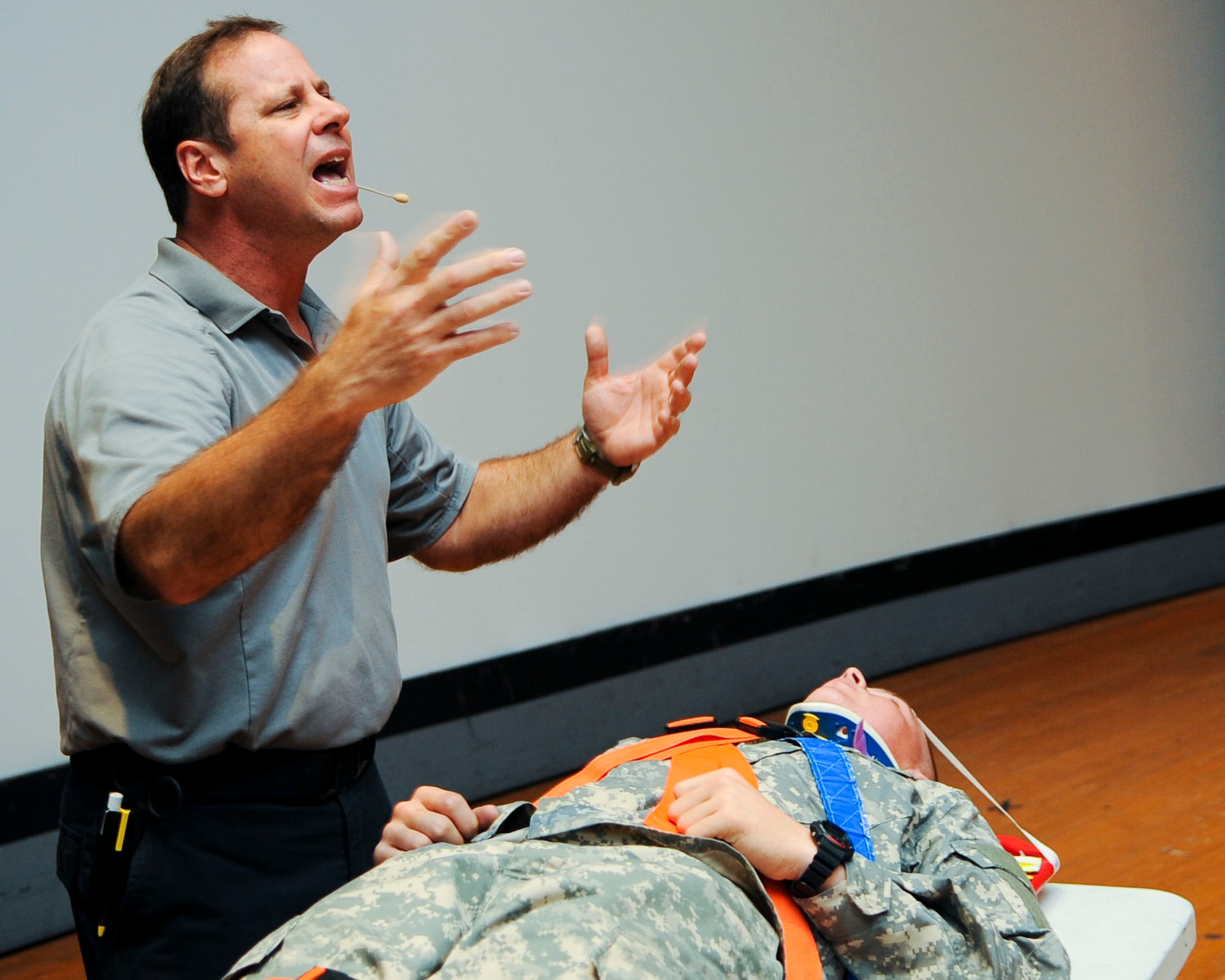 Ralph Jimenez, Miami-Dade County, Fla., Fire Rescue paramedic, explains what happens after a vehicle-accident victim is removed from the vehicle during a Street Smart presentation at Fort Eustis, Va., Nov. 7, 2013. The presentation consisted of graphic photos of deceased victims, demonstrations and explanations about the dangers of driving under the influence or without a seatbelt. (U.S. Air Force photo by Airman 1st Class Austin Harvill/Released)