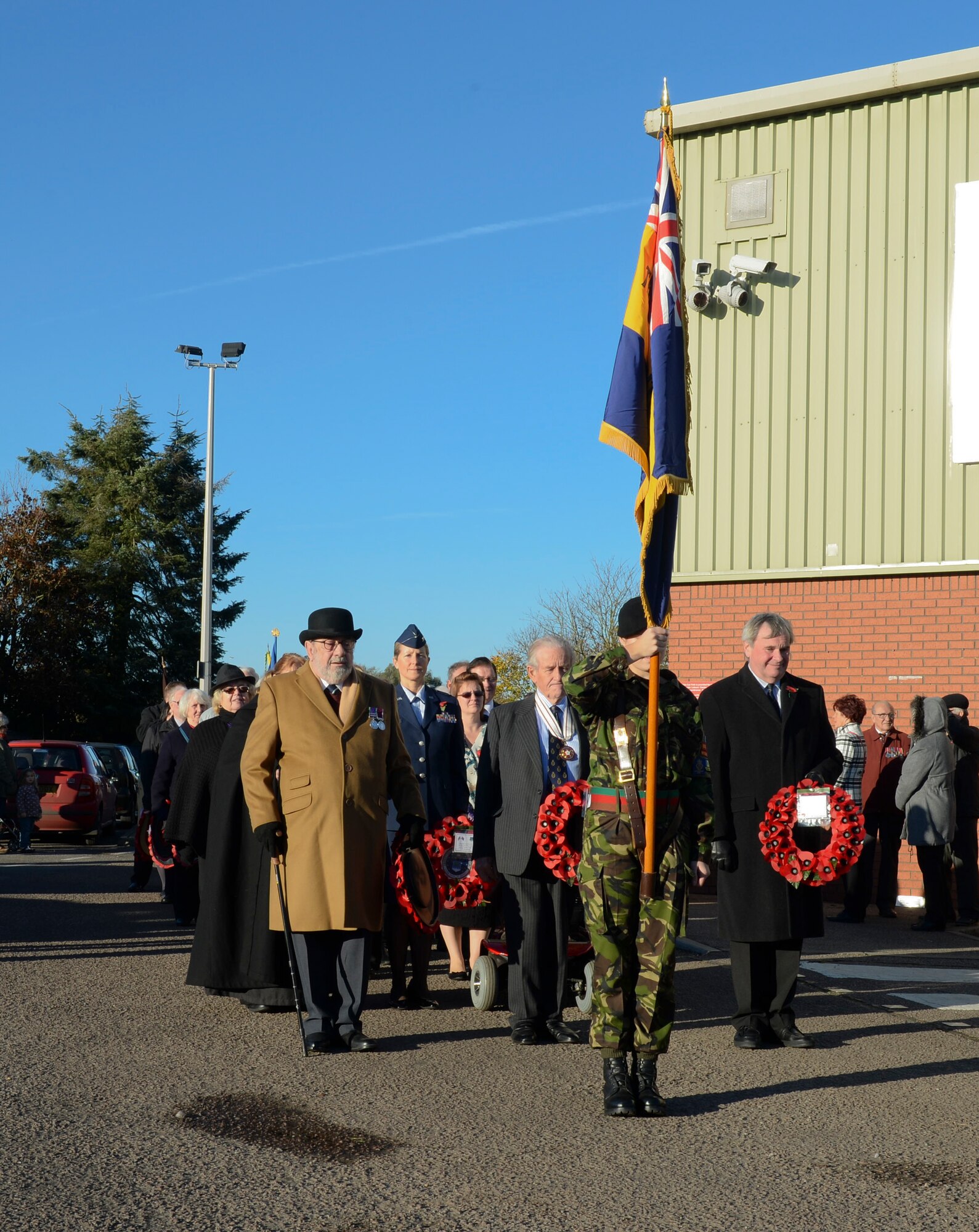 Members of the Brandon, England, community march to the Hillsboro Memorial to participate in the Remembrance Day ceremony in Brandon, Nov. 10, 2013. Remembrance Day, also known as Poppy Day, is observed in the commonwealth to honor members of the armed forces who died in the line of duty. (U.S. Air Force photo by Airman 1st Class Nigel Sandridge/Released)