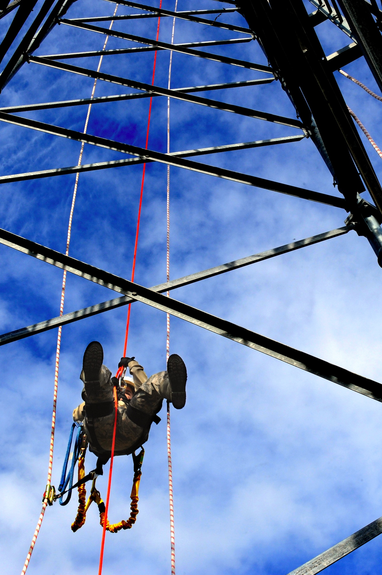 U.S. Air Force Senior Airman Aleksandar Markovic, 4th Communications Squadron airfield systems technician, rappels from 90 feet up a tower at Seymour Johnson Air Force Base, N.C., Oct. 29, 2013. Radar technicians are responsible for maintaining and servicing equipment housed on the tower. (U.S. Air Force photo by Airman 1st Class Aaron J. Jenne)