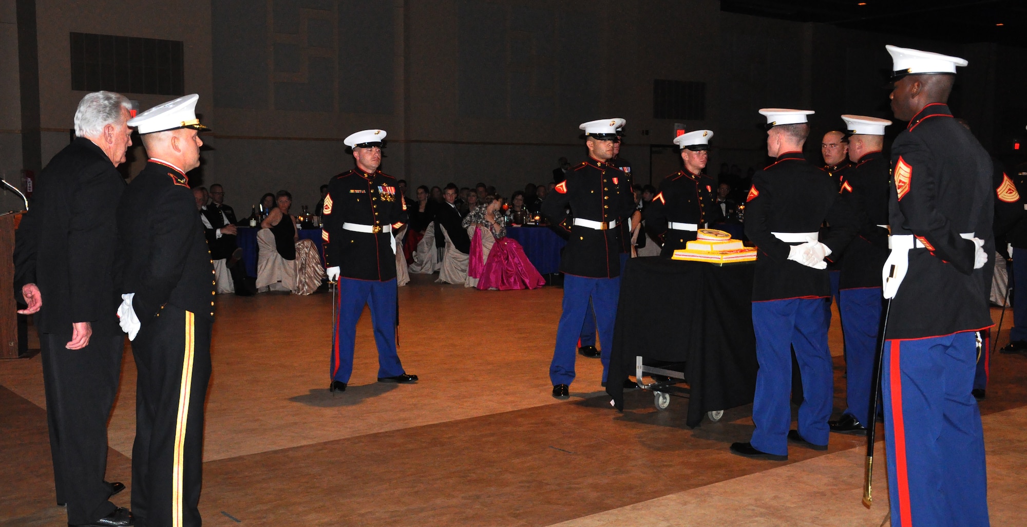 SAN ANGELO, Texas- The cake bearers bring out the traditional birthday cake during the Marine Corps Ball at the McNeese Convention Center Nov. 8. The Goodfellow Marines Corps Detachment celebrated their services 238th birthday which is on Nov. 10. (U.S. Air Force photo/ Airman 1st Class Erica Rodriguez)