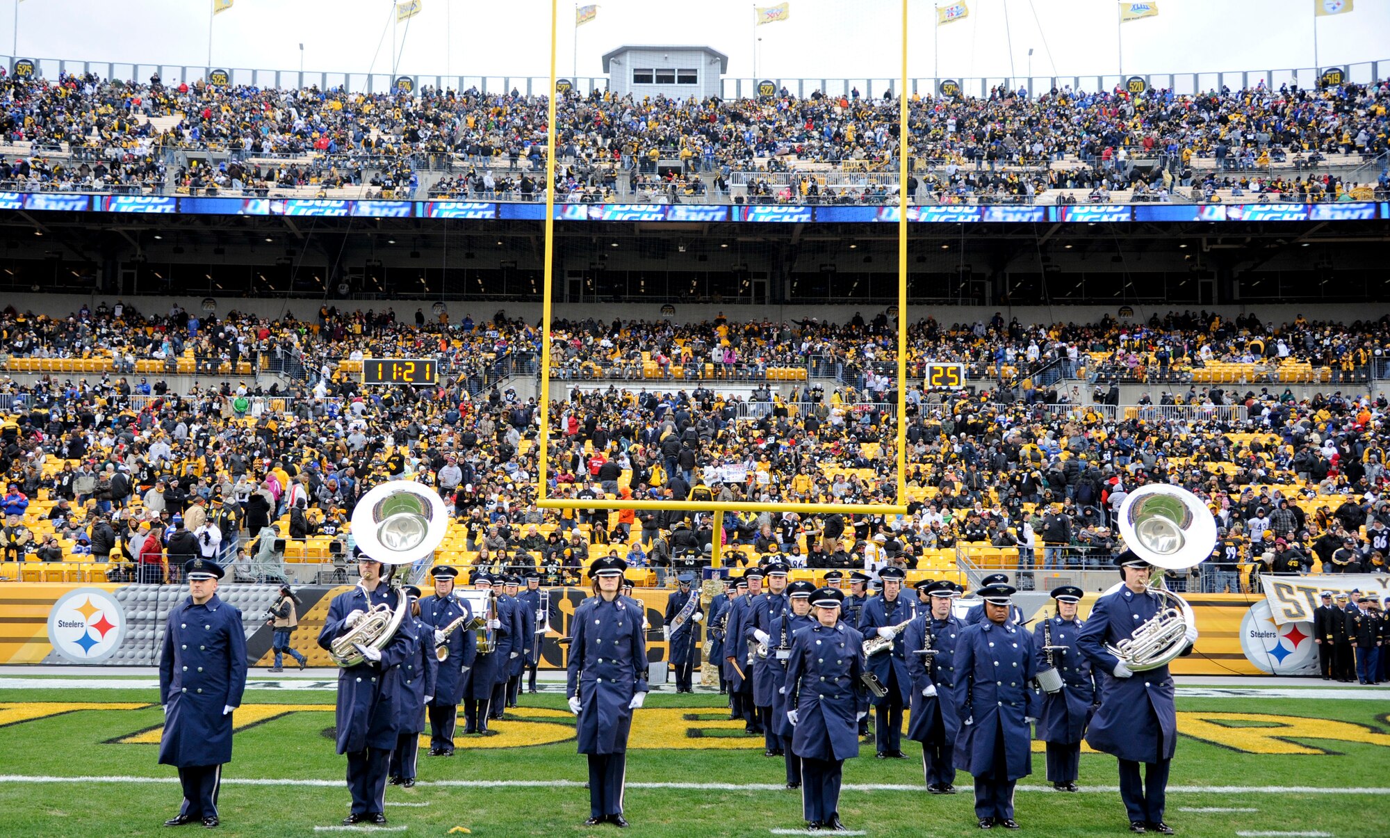 The Air Force Heritage of America Band stands at attention for a final inspection before performing several service medleys at half time for the Salute to Service game at Heinz stadium in Pittsburgh during Veteran’s Day weekend November 10, 2013. (U.S. Air Force photo by Staff Sgt. Steve Stanley/Released)