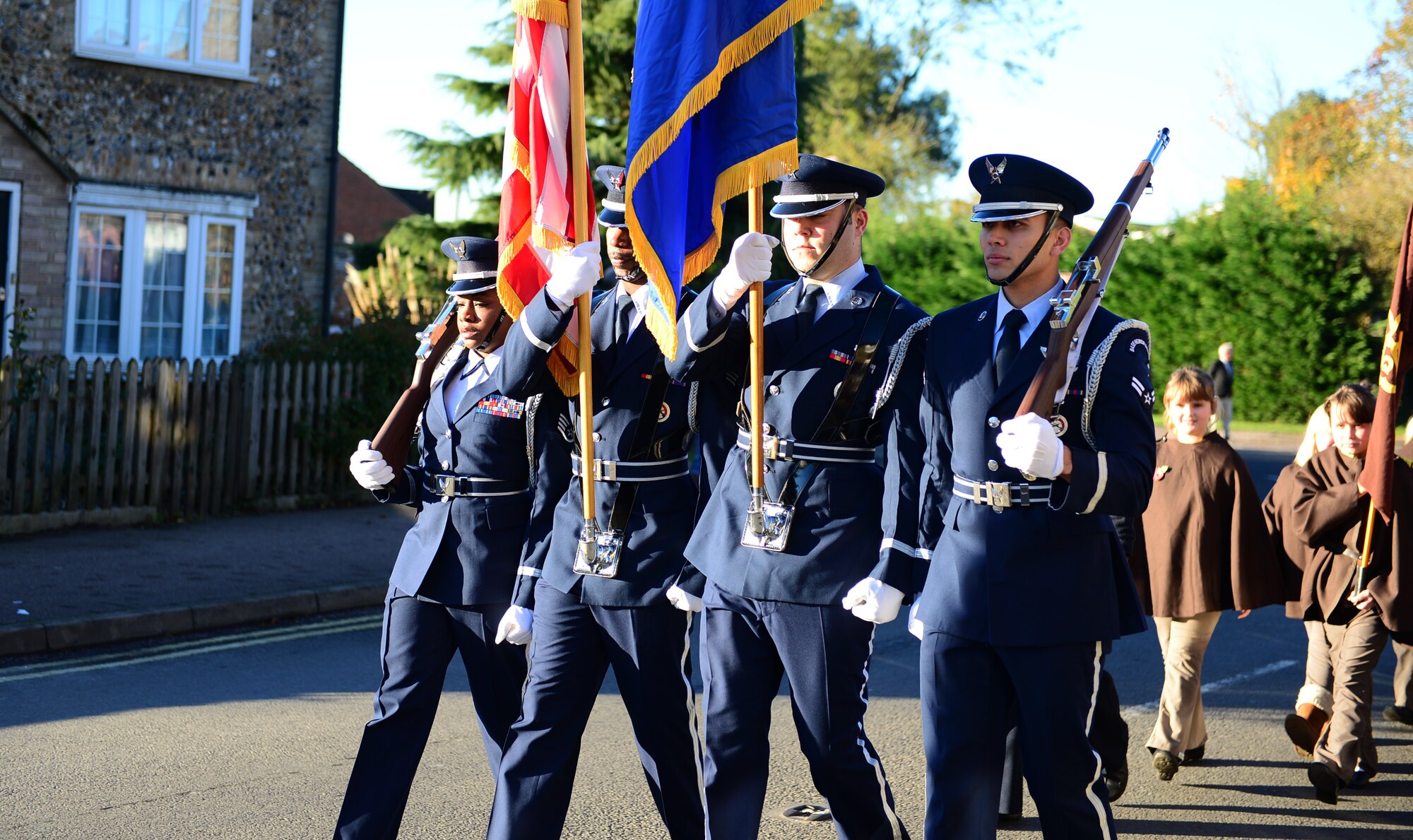 Royal Air Force Lakenheath honor guardsmen march to the memorial site in Lakenheath, England, during the Remembrance Day parade, Nov. 10, 2013. The commonwealth observes Remembrance Day to honor the memories of men and women of the armed forces that have lost their lives in wars, past and present. (U.S. Air Force photo by Airman 1st Class Dawn M. Weber/Released) 